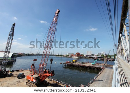 NONTHABURI -THAILAND - JUNE 21 : Concrete bridge across Chaophraya river under-construction of its deep long pile foundation on June 21, 2014 in Nonthaburi, Thailand
