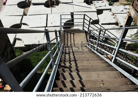 Wooden stair with steel pipe for hand rail