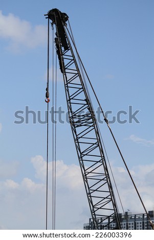 Lifting crane at bridge construction site.