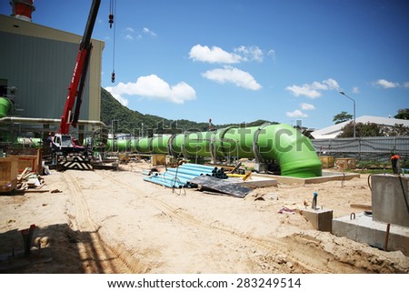 MAY 28, 2015 : KHANORM, THAILAND. Construction of gas combine cycle power plant with cooling water piping system in Khanorm province, southern region of Thailand.