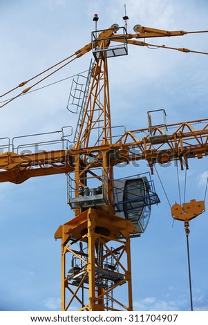 Lifting crane at site of concrete bridge under-construction.