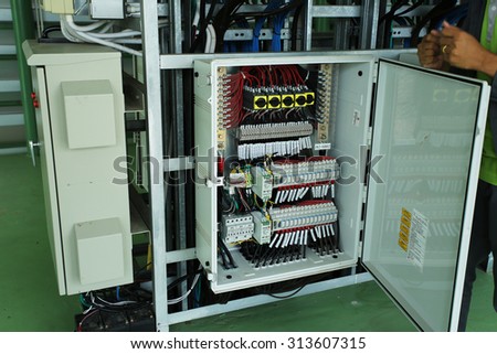 NAKHONSAWN-THAILAND - SEPTEMBER 03 : The switchgear equipment and view of solar equipment, building  in solar farm on September 03, 2015 in Nakhonsawan province, Thailand