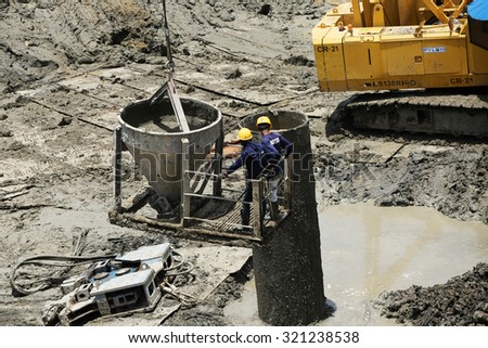 AUGUST 30, 2015 ; NONTHABURI - THAILAND : Concrete boring pile foundation under-construction in wet process with heavy equipment at Eletricity generating authority of Thailand, Nonthaburi province.