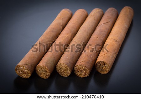 Cuban cigars on black background