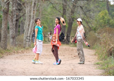 Portrait of Beautiful young traveler woman walking in forest (Phukradung), thailand