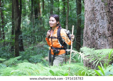 People hiking - happy hiker trekking as part of healthy lifestyle outdoors activity. Traveler tourist walking in National Park.