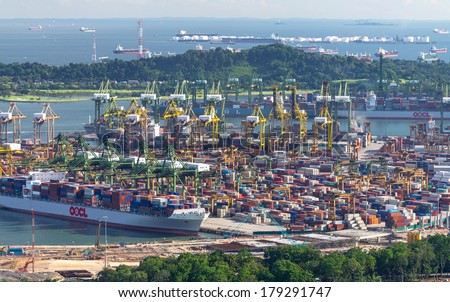 SINGAPORE - JULY 8: Singapore commercial port on JULY 8, 2012 in Singapore. It's the world's busiest transshipment port and the world's second-busiest port in terms of total shipping tonnage.
