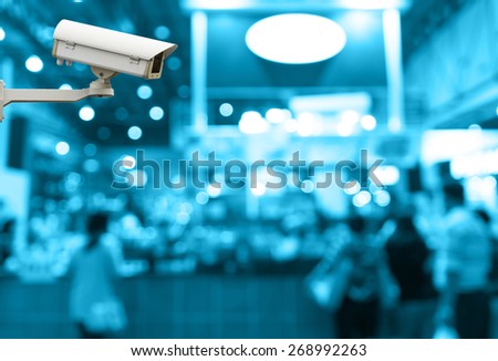 CCTV security camera on monitor the abstract coffee shop store blurred in hall with bokeh background