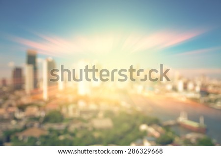 abstract Blurred photo of cityscape with sun background, blur backgrounds concept.