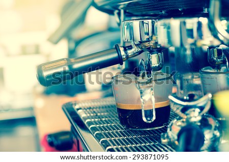 Coffee machine making espresso shot in a cafe shop