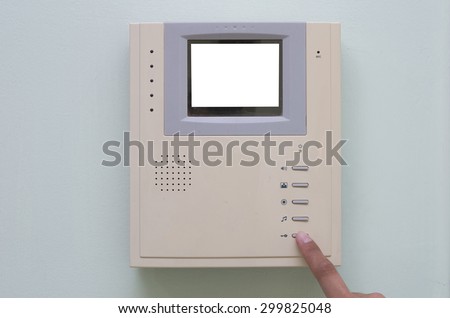 Human finger pushing button of video intercom equipment