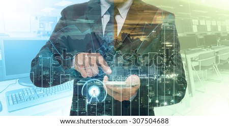 Double exposure of businessman using the tablet with cityscape and financial graph which have earth and world map on computer blurred background, Elements of this image furnished by NASA