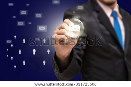Businessman writing the mail with world map and people logo background, Elements of this image furnished by NASA