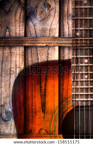 Acoustic guitar art on wooden background