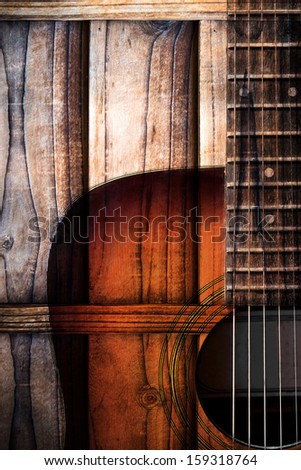 Acoustic guitar art on wooden wall background