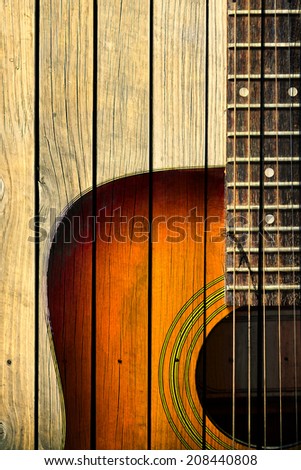 Acoustic guitar art on wooden wall