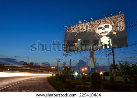 Halloween advertisement on billboard at twilight