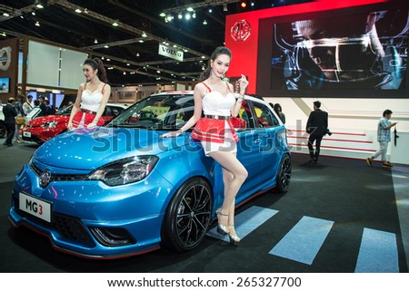 BANGKOK - March 24, 2015 : Unidentified model with MG car on display at The 36th Bangkok International Motor show on March 24, 2015 in Bangkok, Thailand.