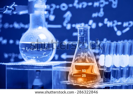 Flask containing chemical liquid with lab background