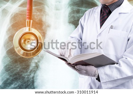 Doctor reading text book with stethoscope background