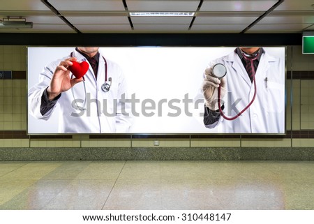 doctors holding red heart and stethoscope on billboard with white space