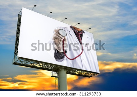 doctor holding stethoscope on billboard with white space