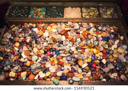 The energy of a box full of colorful mixed gemstones