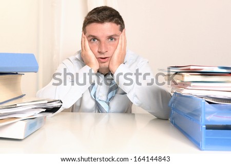 Overwhelmed Stressed Overworked Student  or Businessman at Work