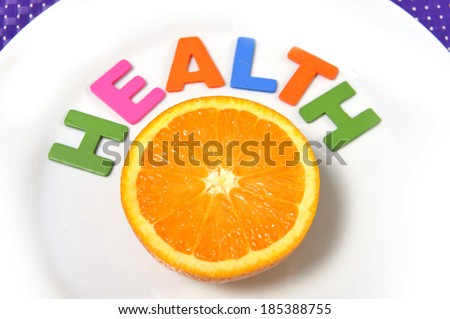 Halved fresh and healthy Orange Fruit stillife on plate health concept