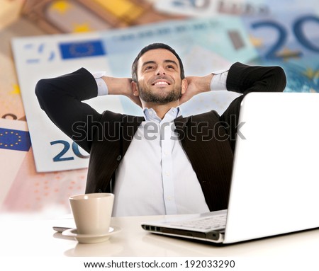 Attractive Happy Young Business Man with beard  sitting at office desk leaning back on his chair Thinking and Dreaming of Big Money over Euro Currency Background