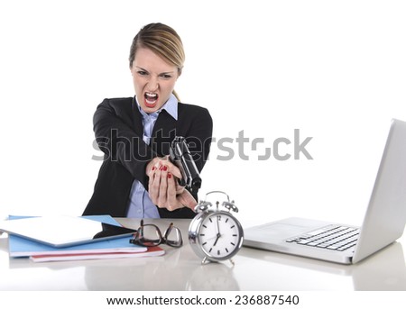 young attractive businesswoman furious and angry working with computer laptop pointing gun to alarm clock in out of time, long hours of work and project deadline stress