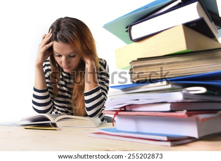 Young Stressed Student Girl Studying Pile Of Books On Library Desk ...