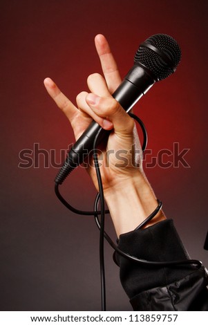 Microphone in hand. Rock style.
