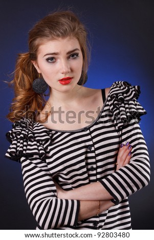 beautiful young girl in a striped blouse