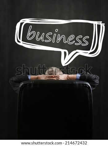 Businessman relaxing on his chair while the business grows