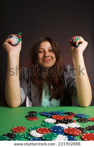 young sexy woman playing poker. Emotions victory