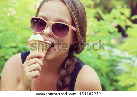 chubby girl eating pistachio ice cream