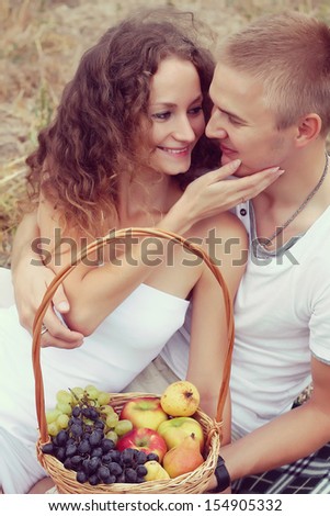 outdoor fashion portrait of young sensual couple. love and kiss