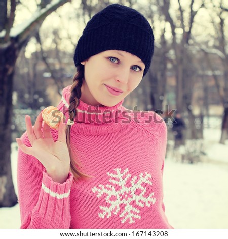 Young beautiful woman in winter clothes. Portrait outdoors