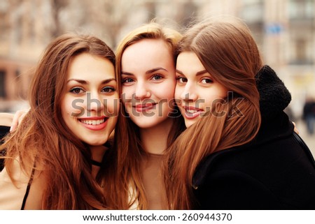 Similar – Image, Stock Photo Three girlfriends having fun taking a selfie