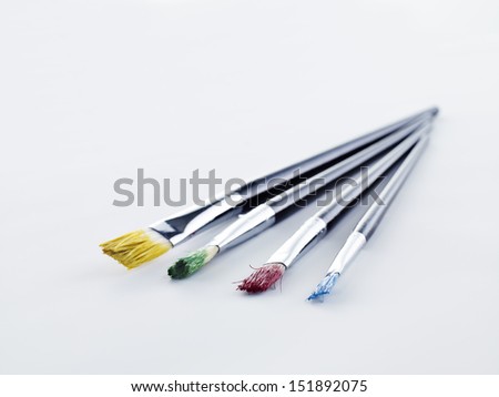 Paint brushes in different colors.