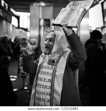 NEW YORK - DECEMBER 27, 2012: A christian preacher, holding the Bible in one hand, warns the tourists of the Apocalypse to come. This prophet sends tirelessly the same message for more than 10 years