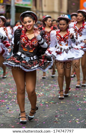 NEW YORK - FEBRUARY 2, 2014: Beautiful girls march in formation at the Lunar New Year Festival in Chinatown.