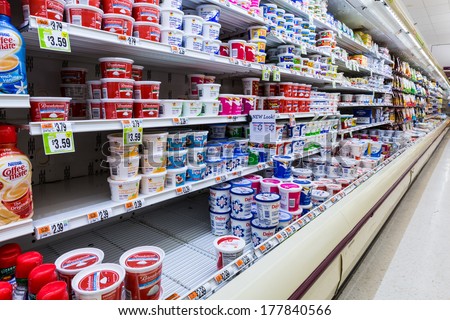 MADISON, NJ, USA - FEBRUARY 13, 2014: Cultured dairy products aisle in an American supermarket. Cultured milk products, known to mankind since antiquity, play an important role in the American diet.