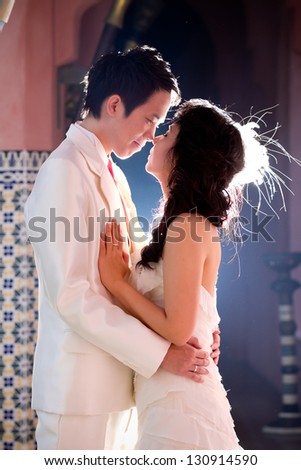 In love bride and groom are posing in romantic emotion