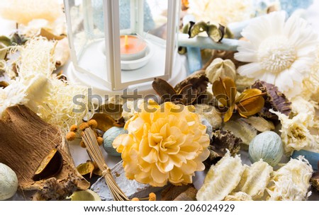 Dried flowers with lamp and candle for scented perfume aroma therapy
