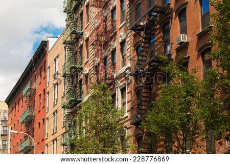 Old colorful buildings with fire escape in Little Italy, New York City, USA