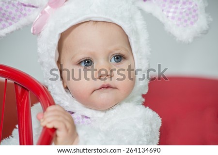 six month girl in white rabbit costume