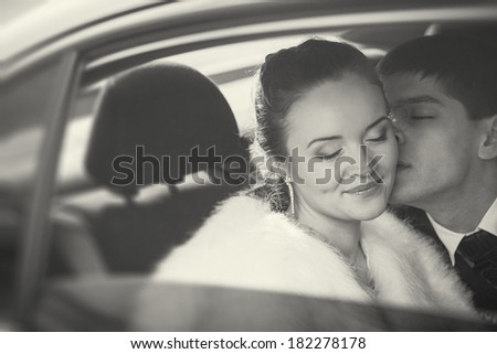 the couple kissing in the car