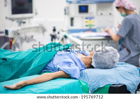 patient lay down on the bed ready for operation